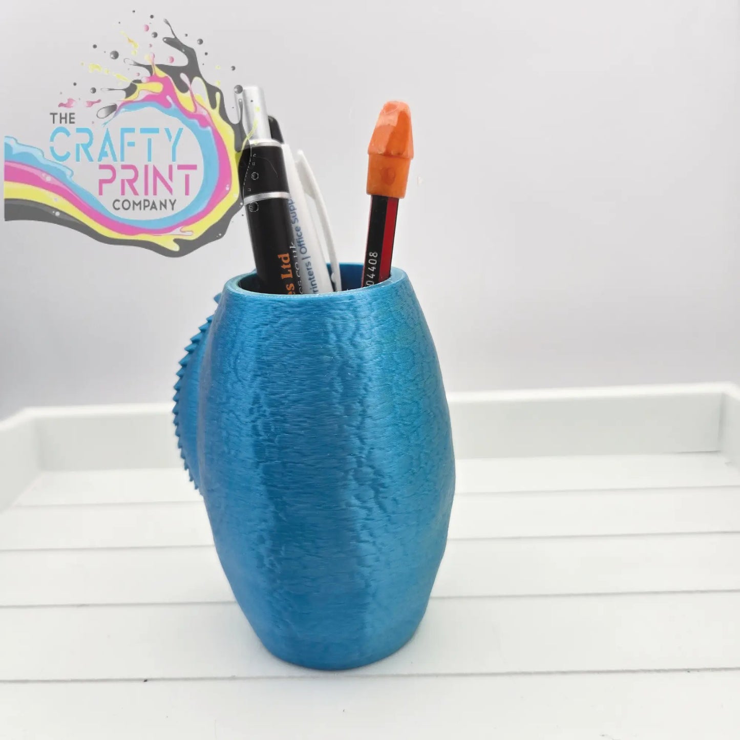 Blue textured 3d printed chameleon pen pot with handle-like protrusion for colorful desk organization
