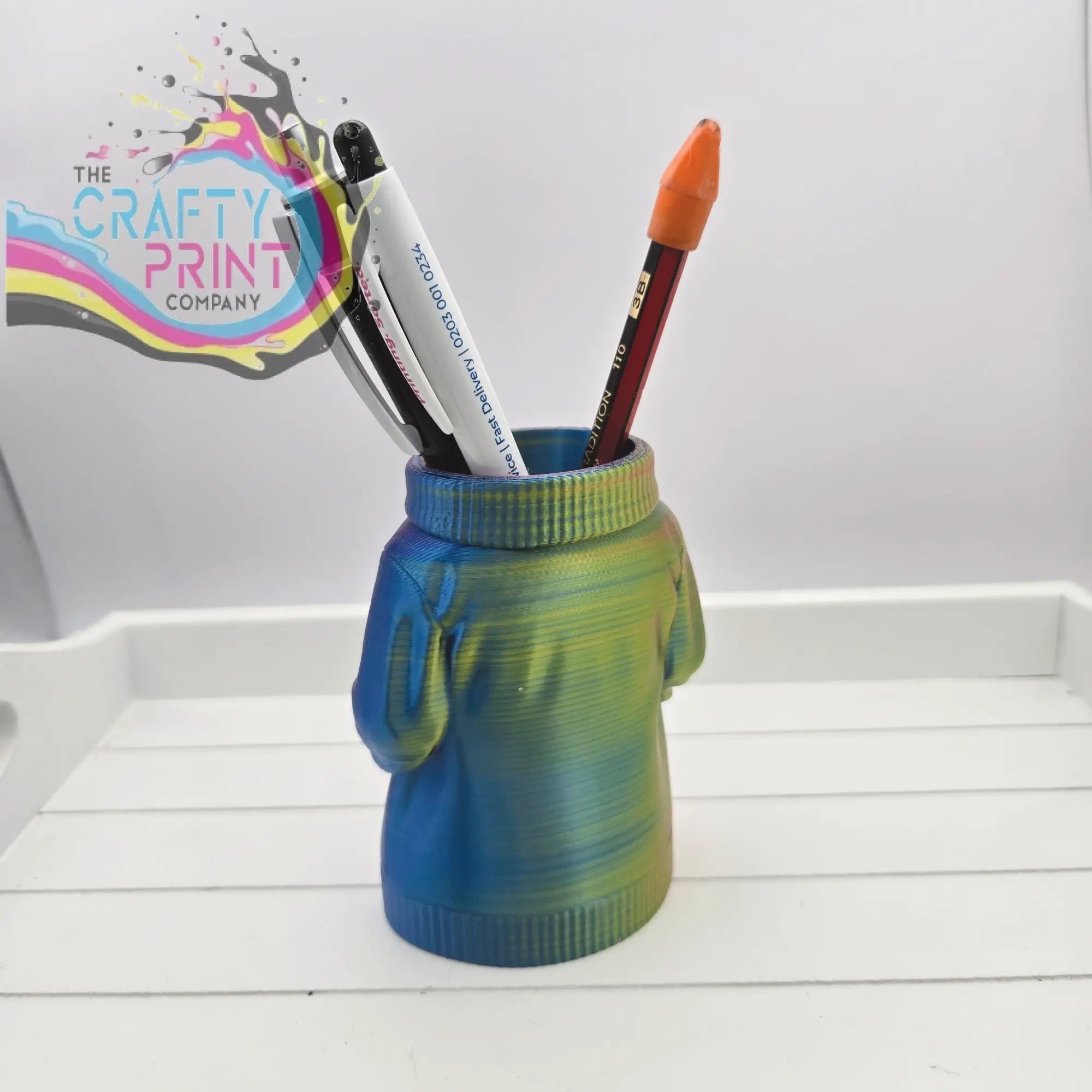 Colorful 3d printed jumper pen pot shaped like a sweater with blue and green gradient hues for desk organization