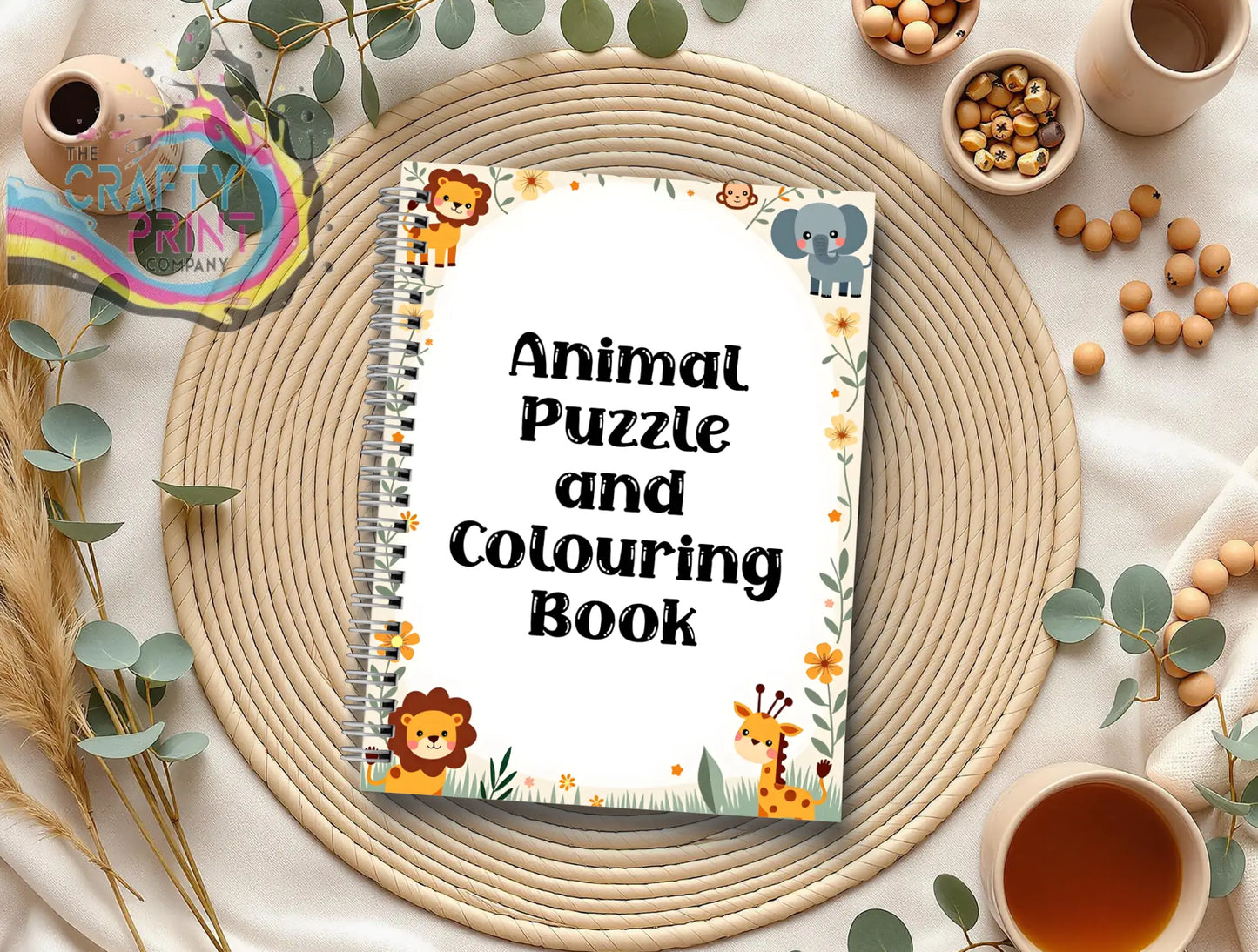 A5 spiral-bound animal activity book for kids with colorful cartoon lions elephants giraffes on white cover