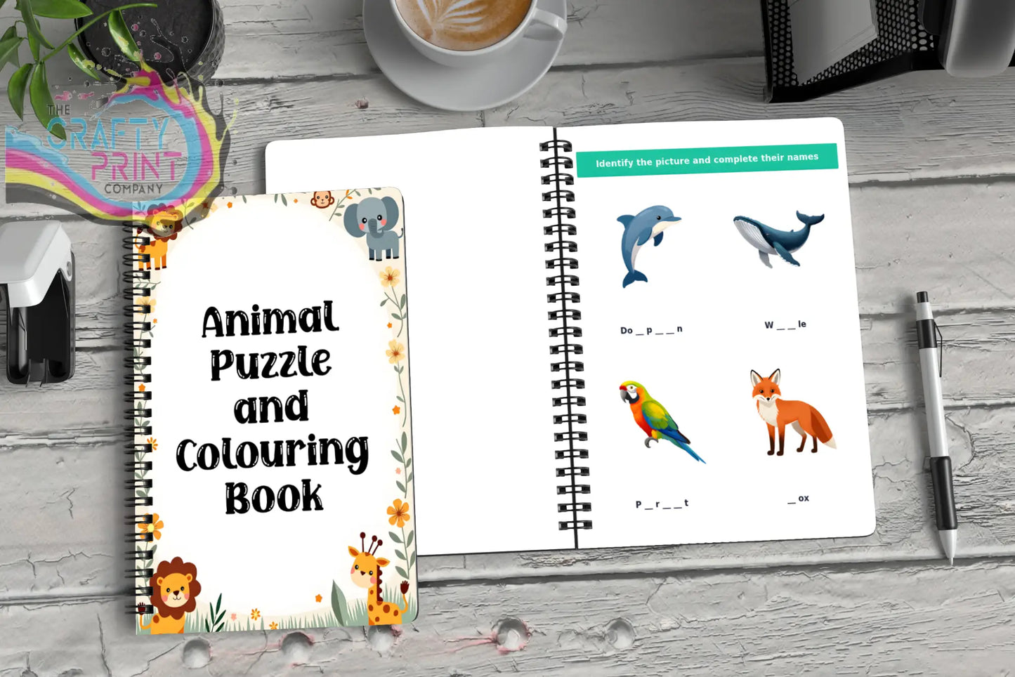 White spiral-bound animal puzzle book for kids with colorful cartoon lions elephants giraffes dolphin and foxes pages activity book