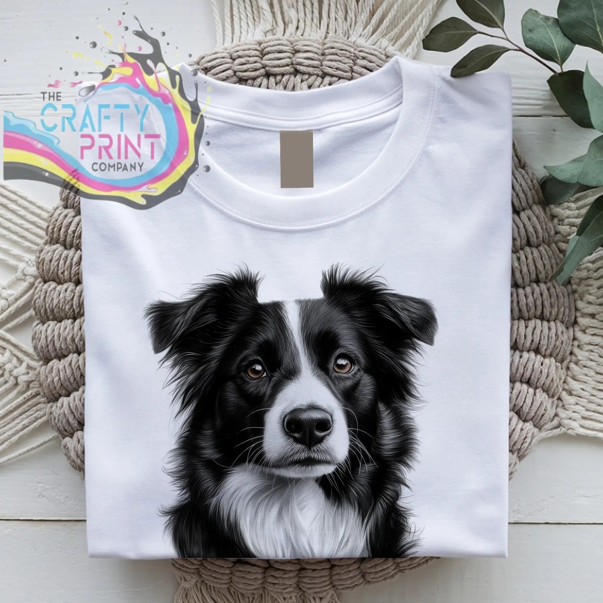 White cotton t-shirt featuring a detailed black and white border collie pencil drawing on the front