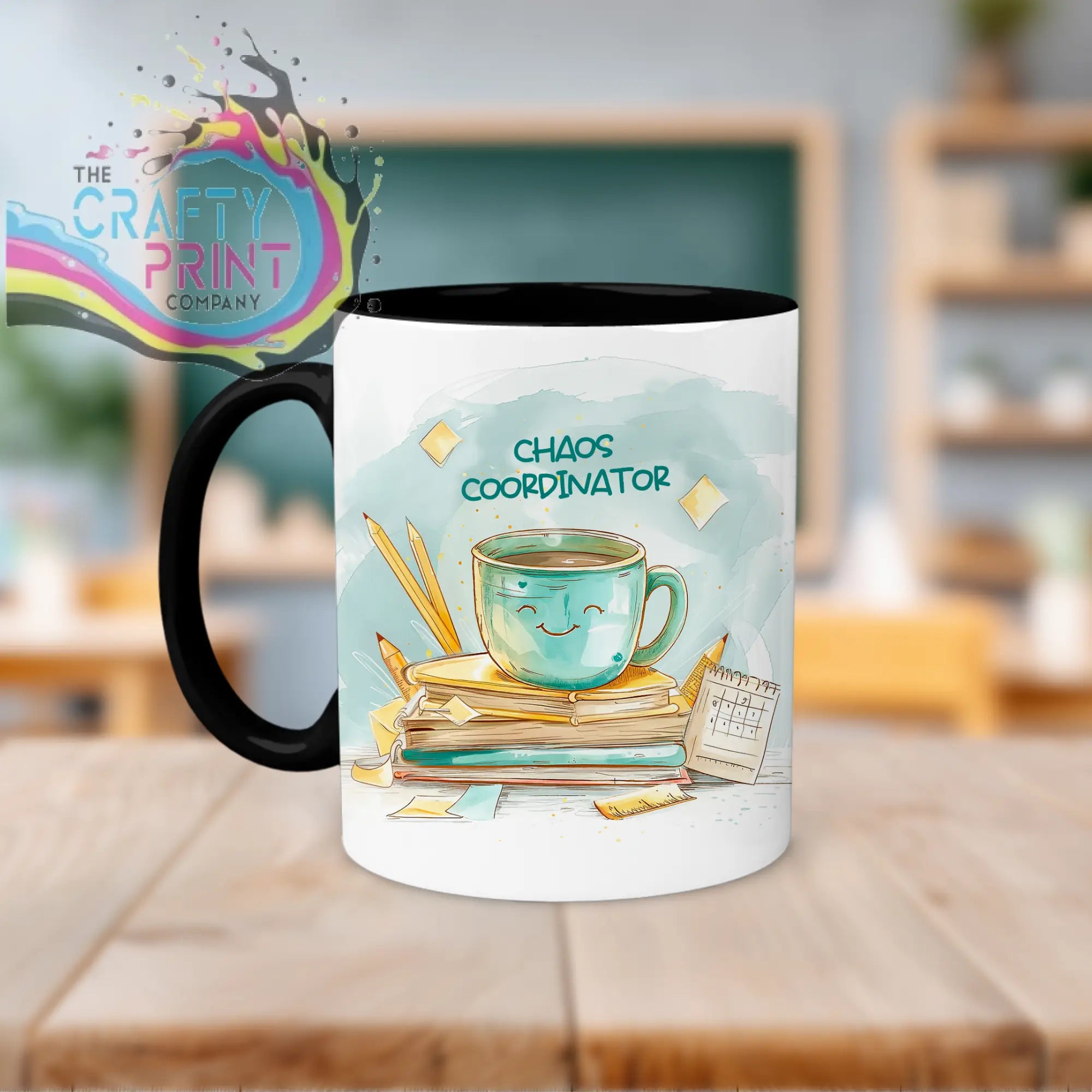 White ceramic chaos coordinator mug with black handle and colorful teal cup illustration for coordinator teacher use