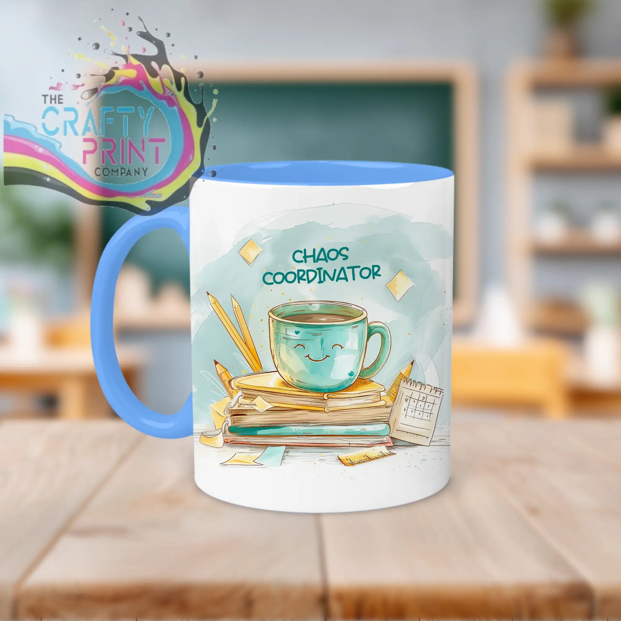 White ceramic chaos coordinator mug with blue handle and watercolor teal coffee cup design for teacher use