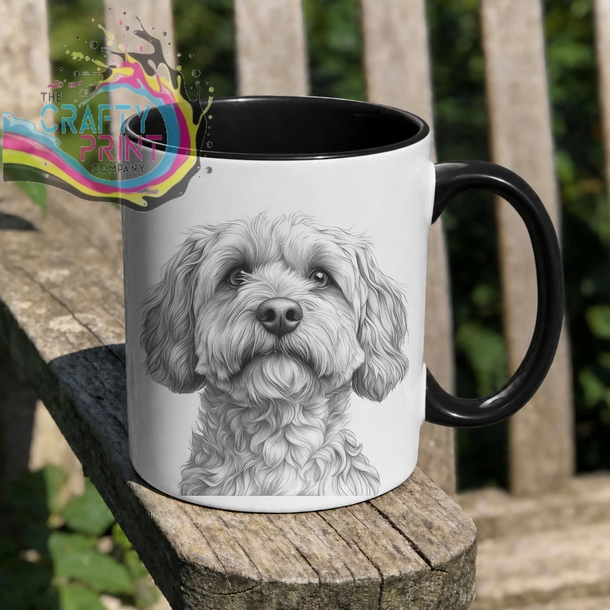 White ceramic pencil drawing mug with black handle interior featuring detailed cockapoo pencil face illustration