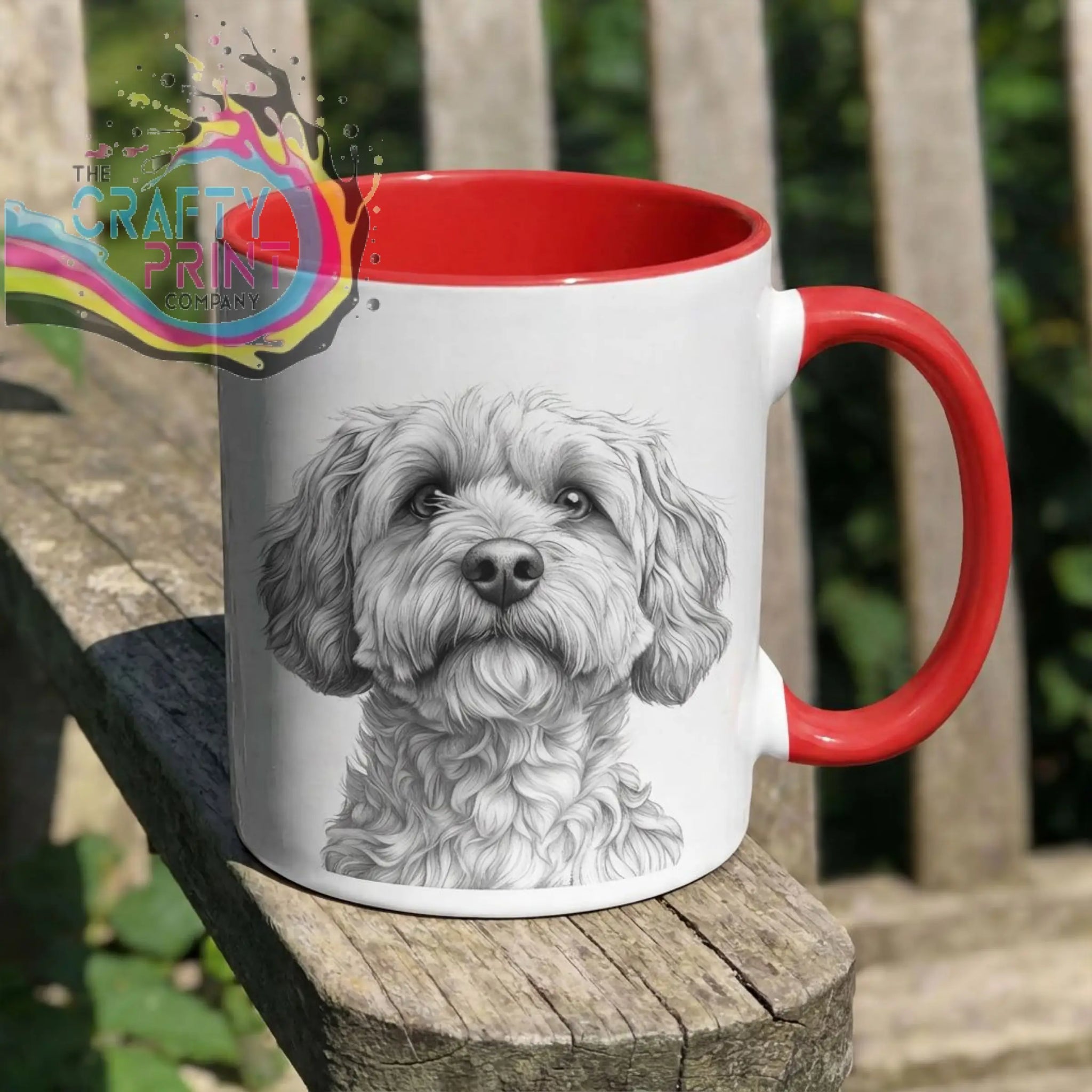 White ceramic pencil drawing mug with red handle and interior featuring a detailed black cockapoo pencil sketch