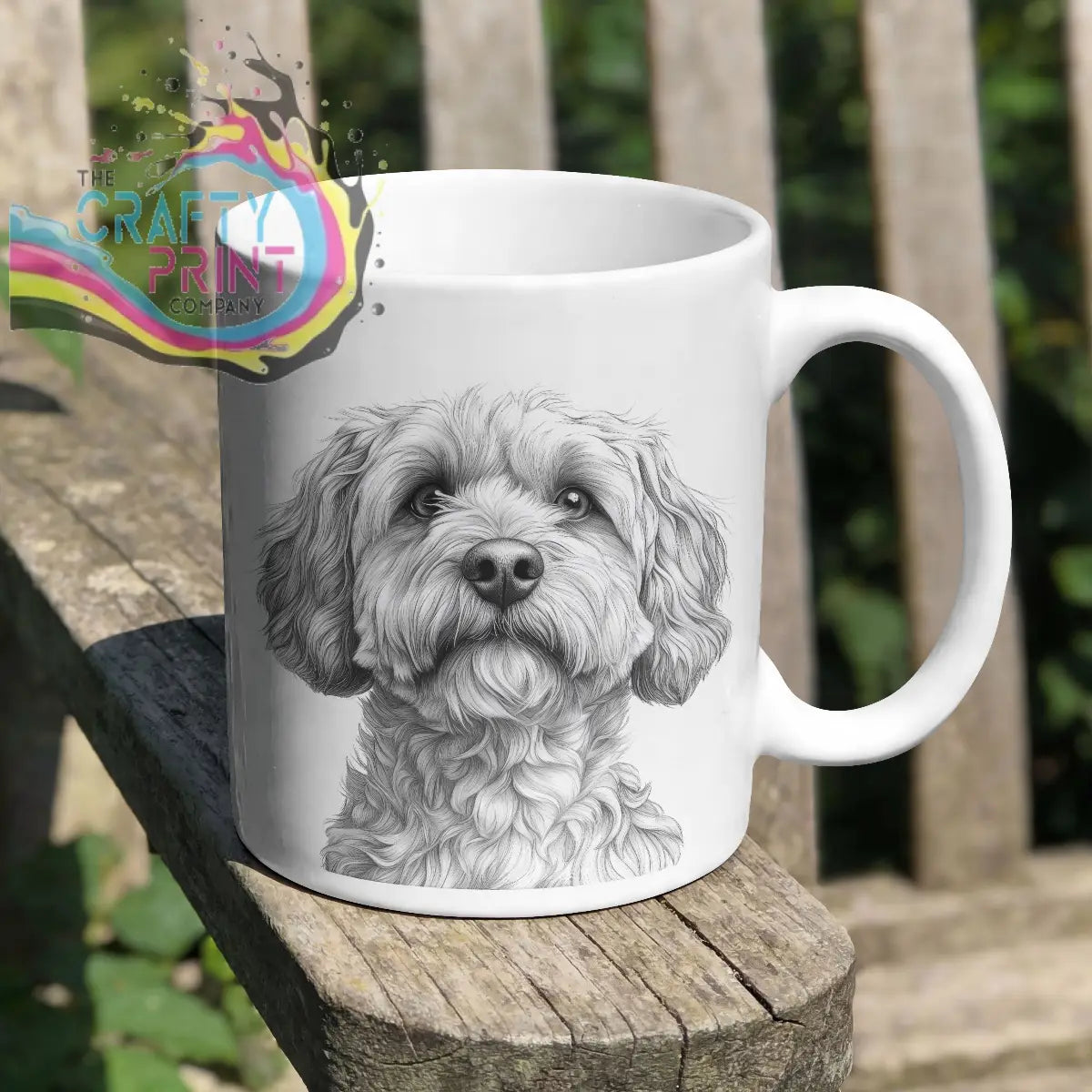 White ceramic mug with a detailed black cockapoo pencil drawing of a fluffy dog face pencil drawing mug
