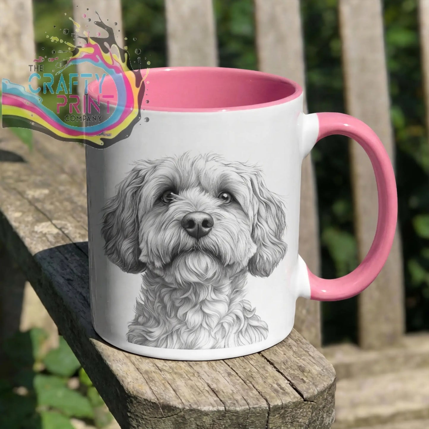 White ceramic cockapoo pencil drawing mug with pink interior and handle featuring detailed dog face illustration