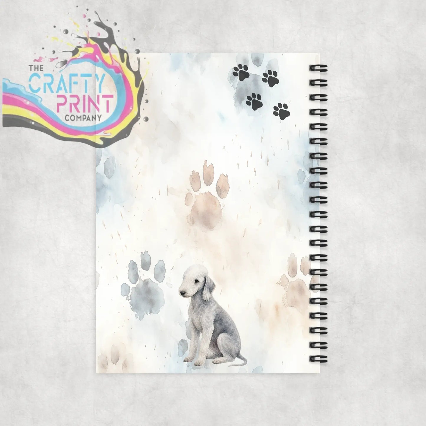 A watercolor-style impawtant notes bedlington terrier a5 spiral notebook with grey dog and paw prints design