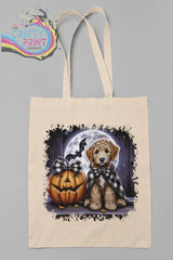 Beige labradoodle halloween cotton tote bag featuring a golden retriever puppy with a pumpkin and full moon background