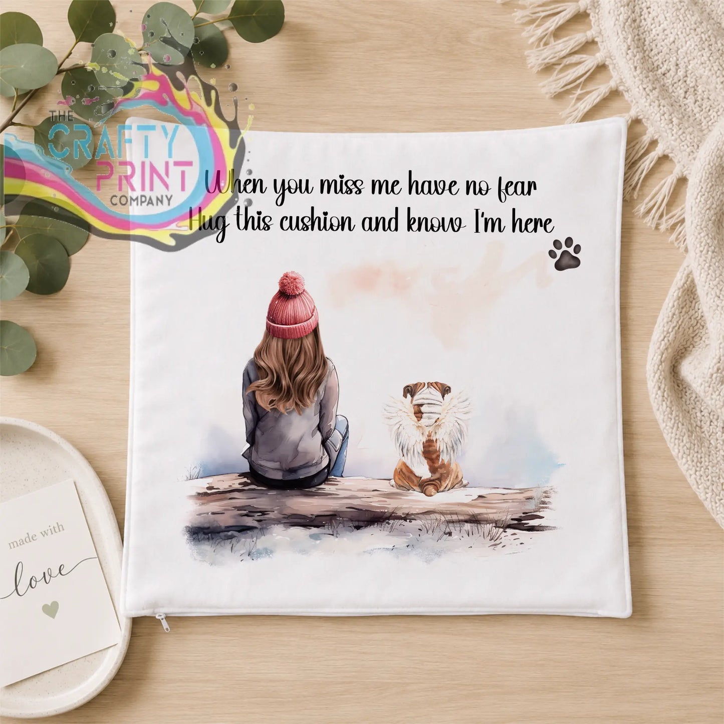 White square personalised dog memorial cushion with pink beanie illustration and hug this cushion text for comfort