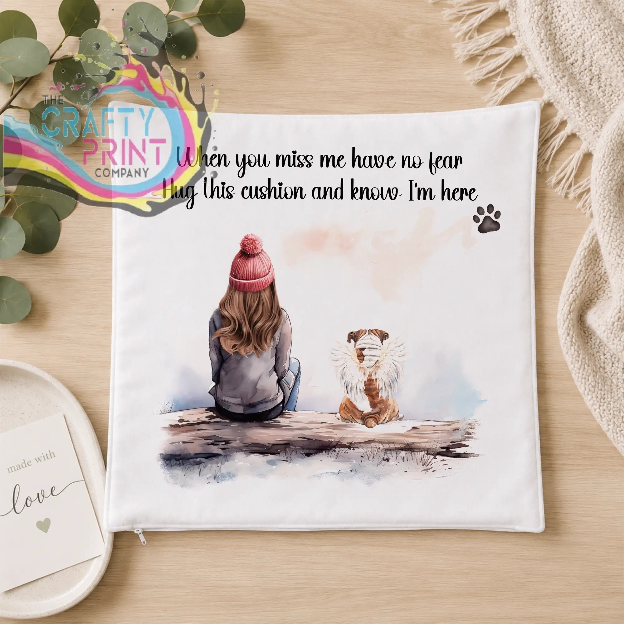 White square personalised dog memorial cushion with pink beanie illustration and hug this cushion text for comfort