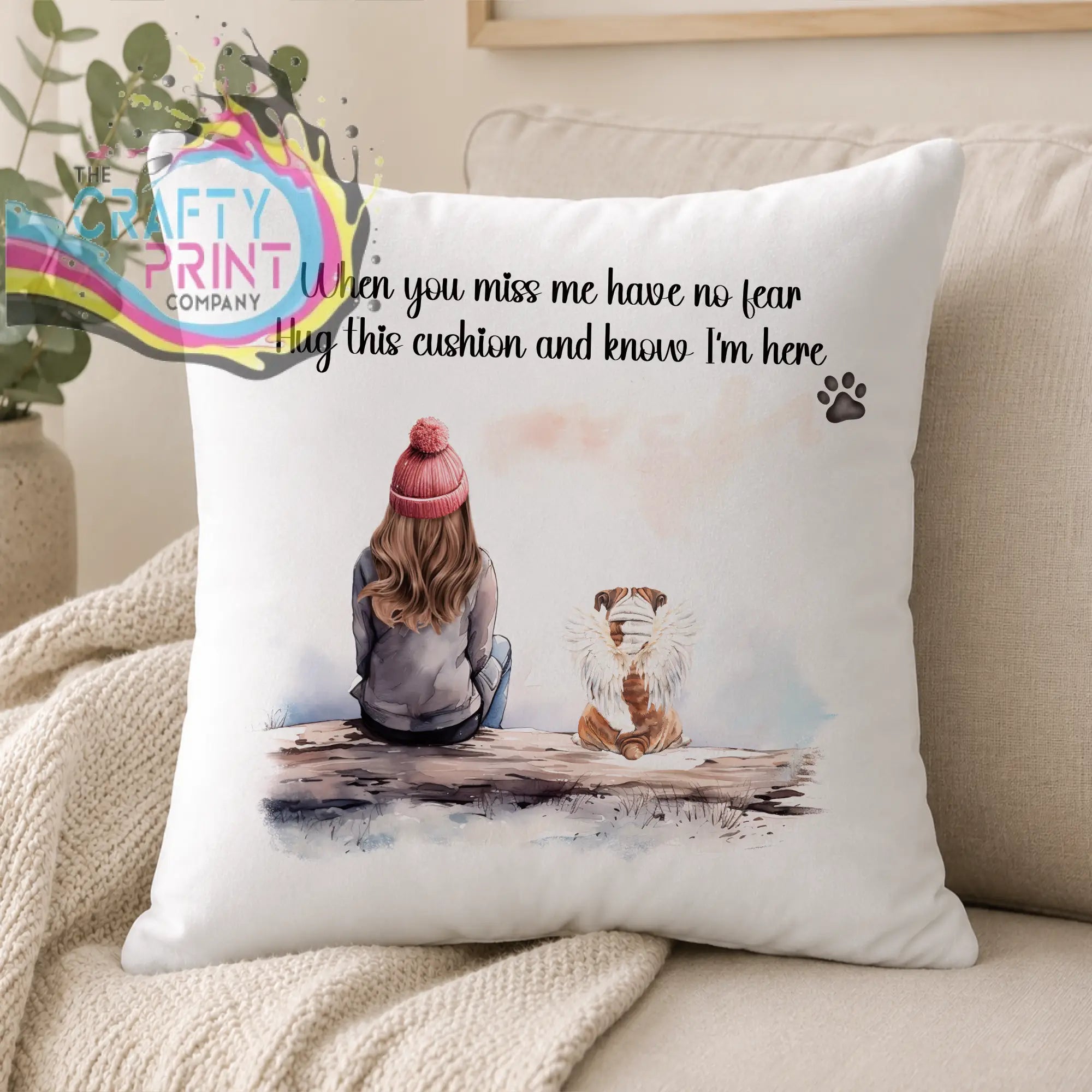 White personalised dog memorial cushion with watercolor girl and dog illustration and comforting hug message text