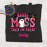 Black cotton tote bag with glittery pink miss trick design featuring ghost bats and a witch hat for treats