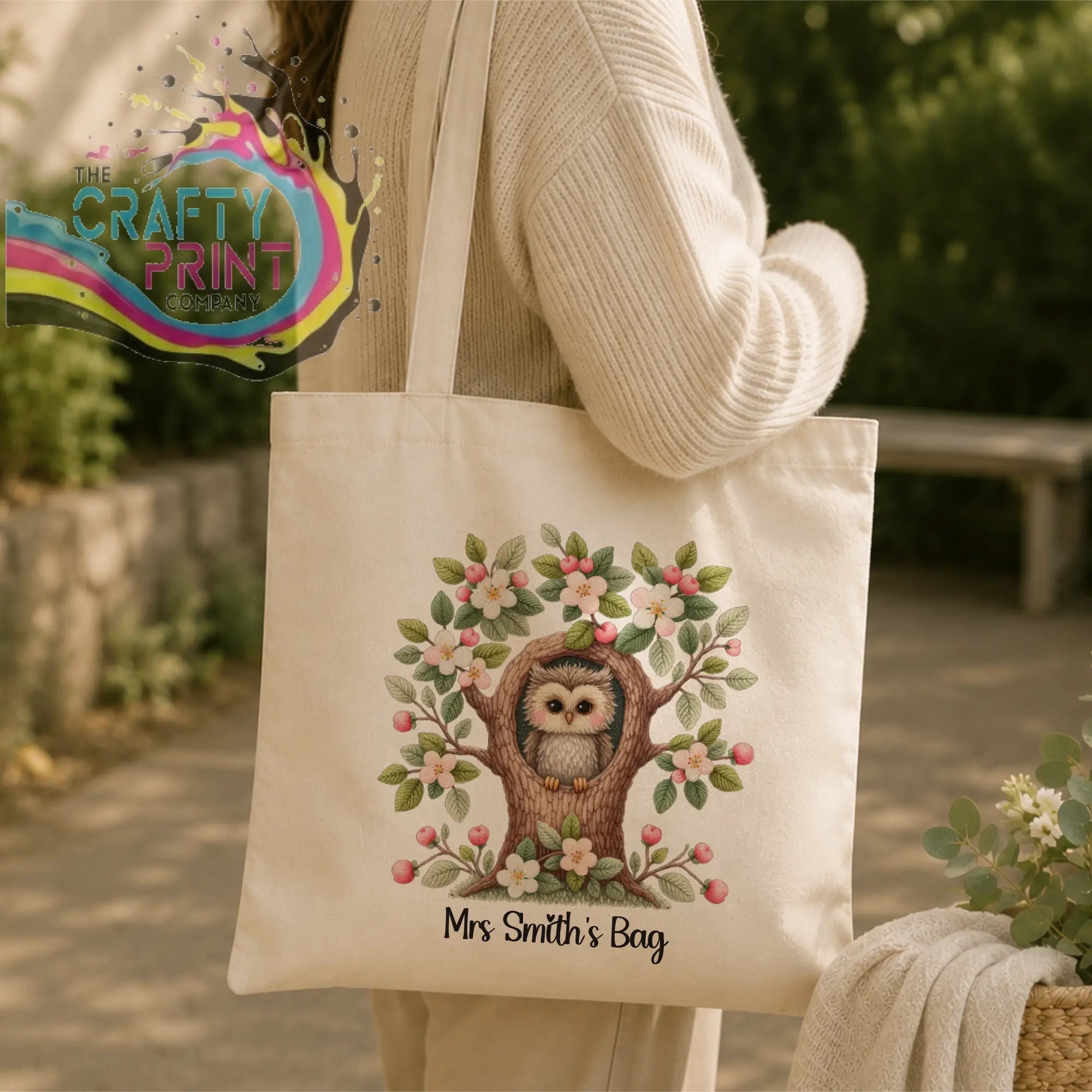 Cream-colored canvas tote bag with a personalised owl teacher design featuring an owl in a blossom tree and text mrs smiths bag