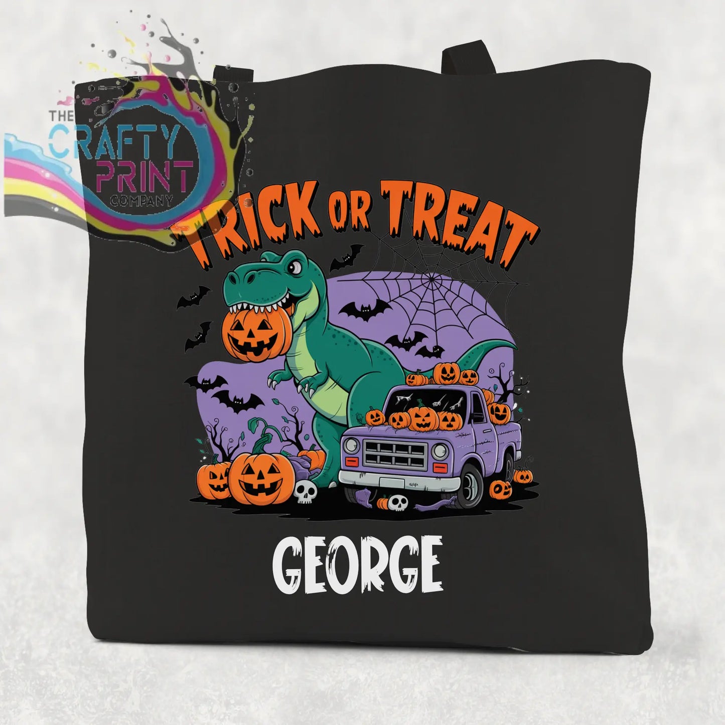 Black canvas personalised trick or treat dinosaur cotton tote bag with green t-rex holding pumpkin and halloween design