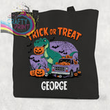 Black canvas personalised trick or treat dinosaur cotton tote bag with green t-rex holding pumpkin and halloween design