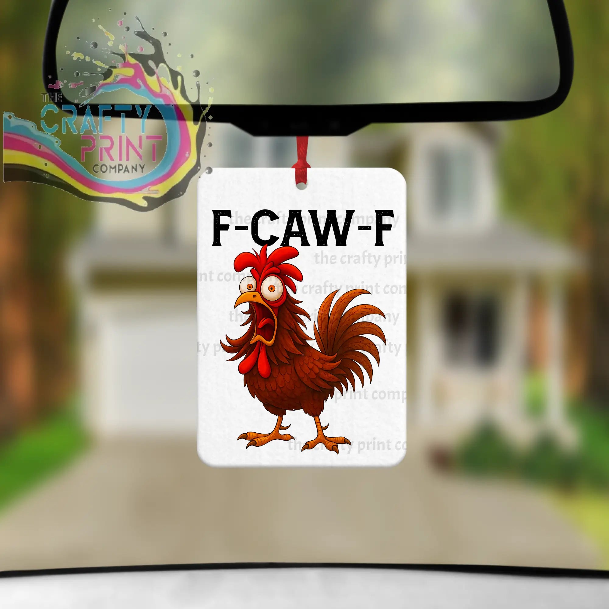 White rectangular car air freshener featuring a cartoon rooster with red comb and text f-caw-f for car air use