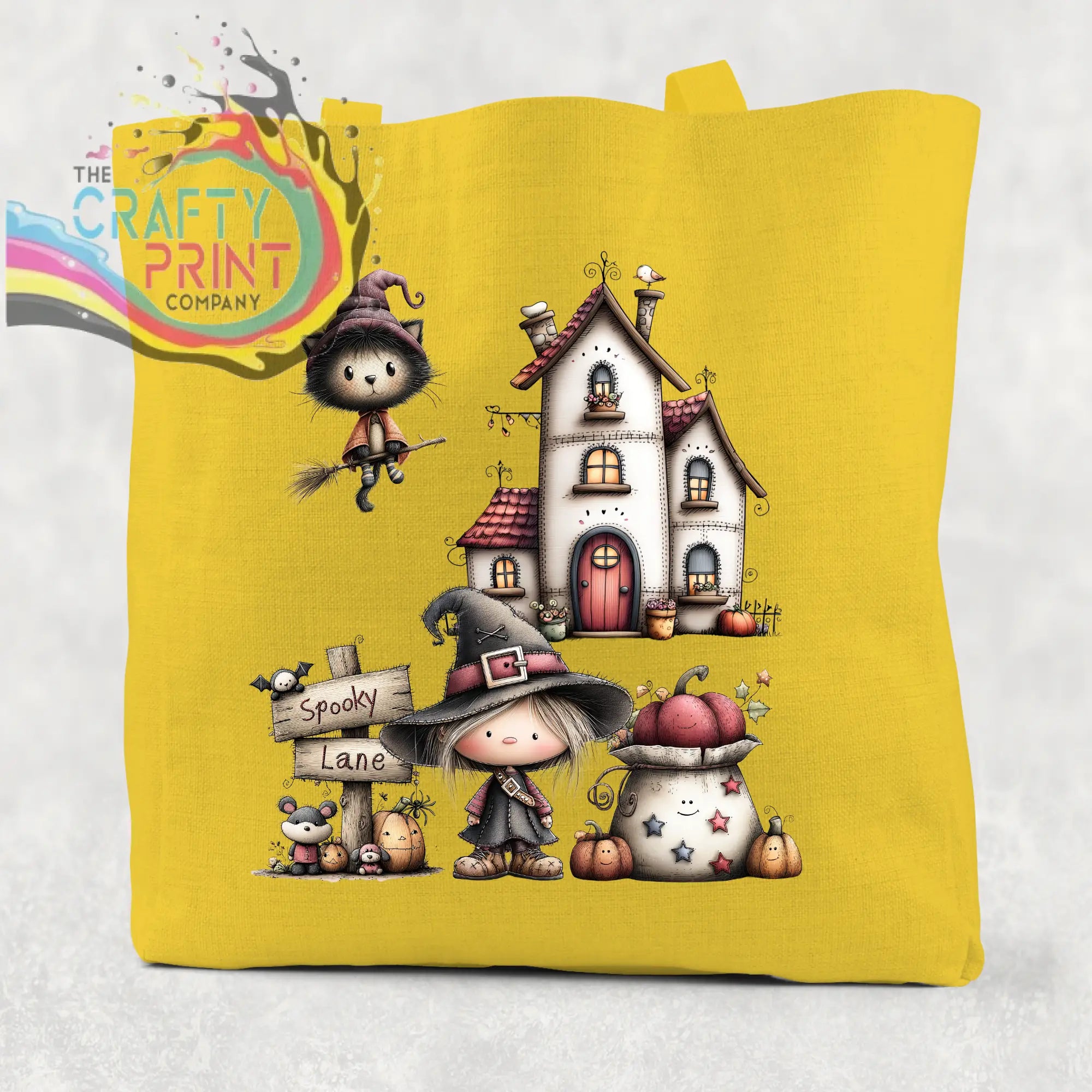 Bright yellow cotton re-usable tote bag with spooky lane halloween witch cat broomstick and house illustration