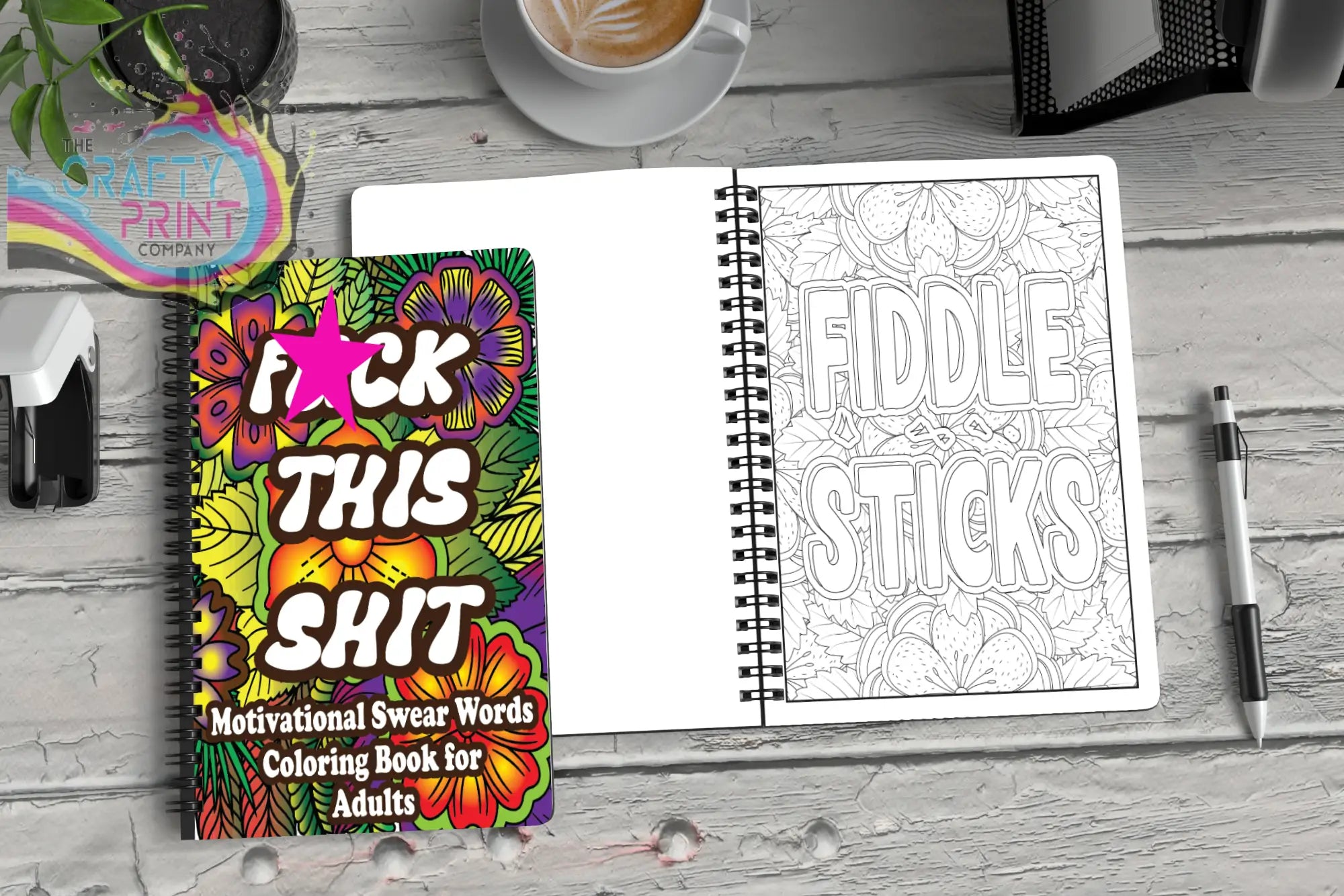 Vibrant floral-patterned swear word colouring book with spiral binding and motivational colouring design in pink and black