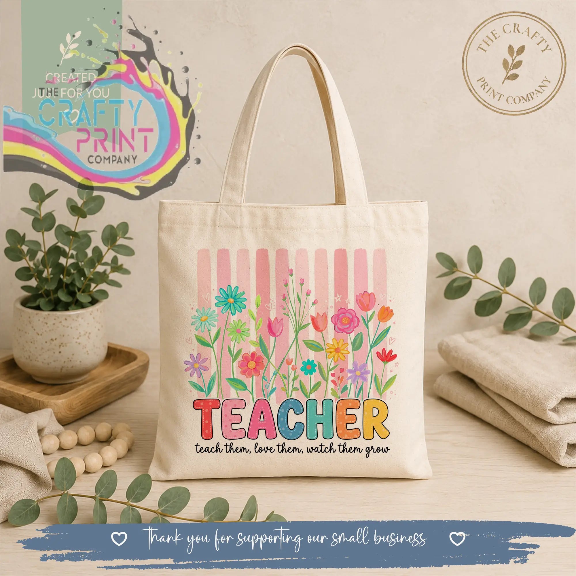 Cream-colored canvas re-usable tote bag with vibrant floral design and colorful teacher text with motivational phrase