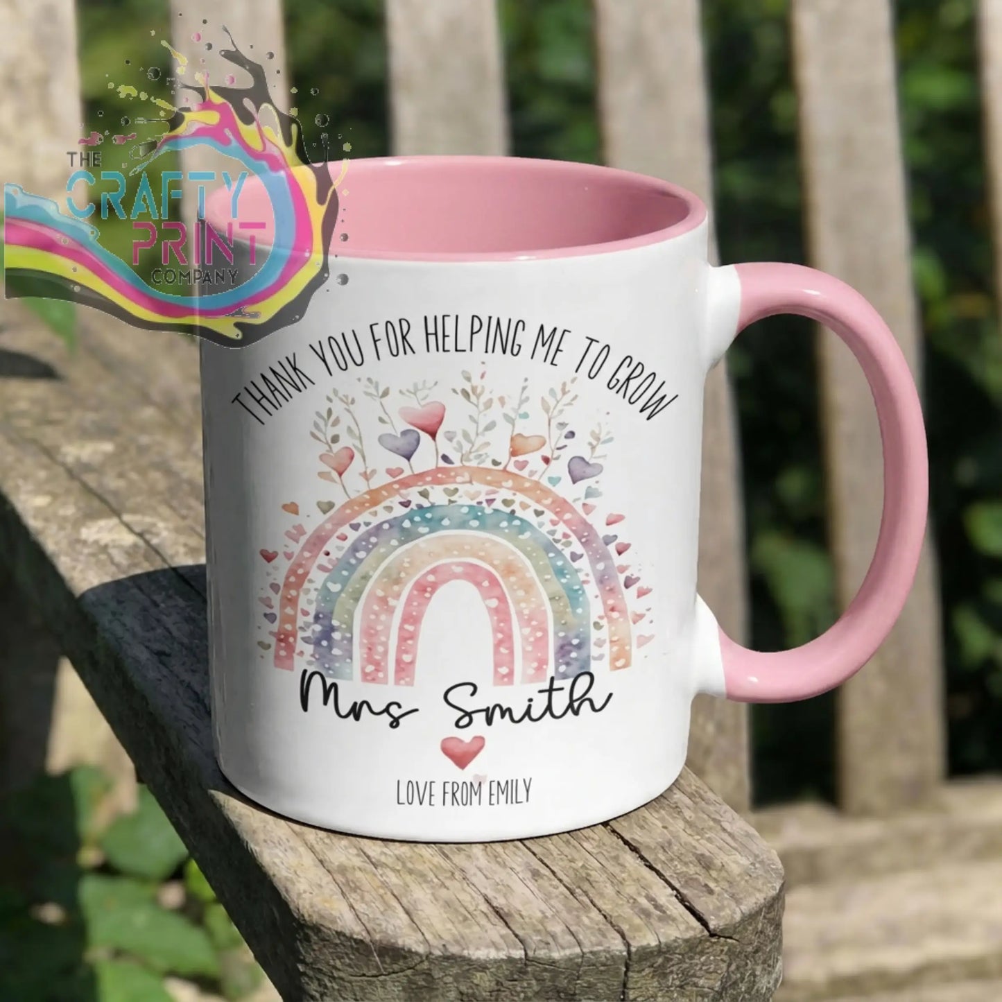 White ceramic grow mug with pink interior and handle featuring rainbow design and thank you message for teacher gifts