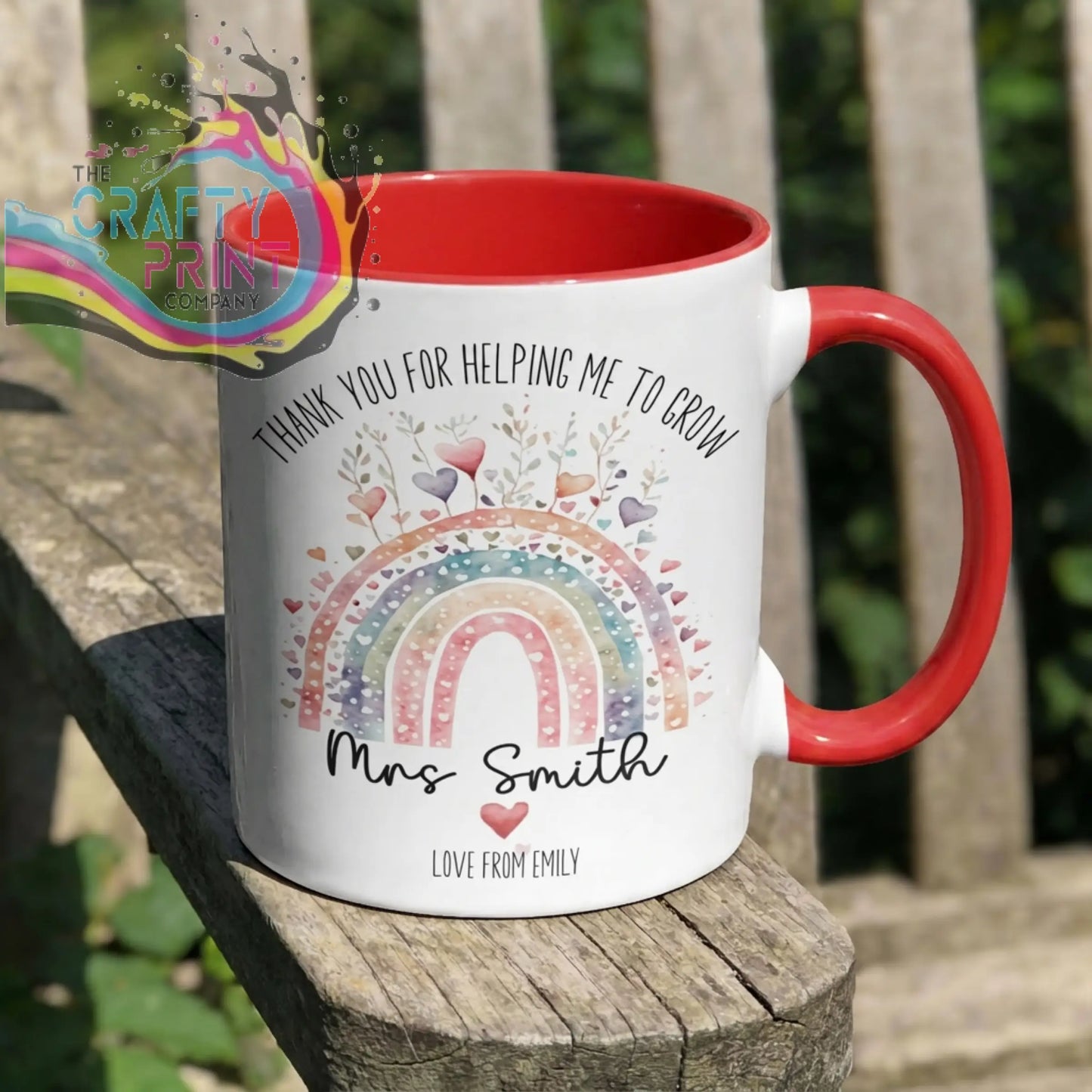 White ceramic grow mug with red interior and handle featuring watercolor rainbow hearts and thank you message for teachers