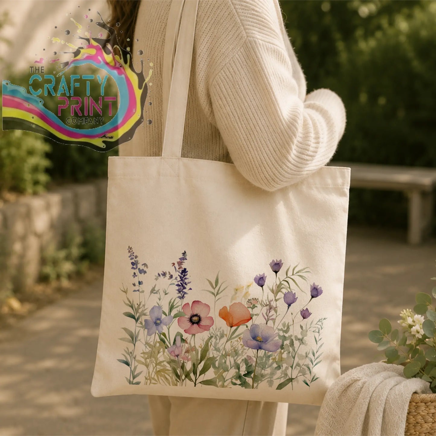 Cream-colored canvas re-usable tote bag with delicate watercolor purple pink and orange wildflower design