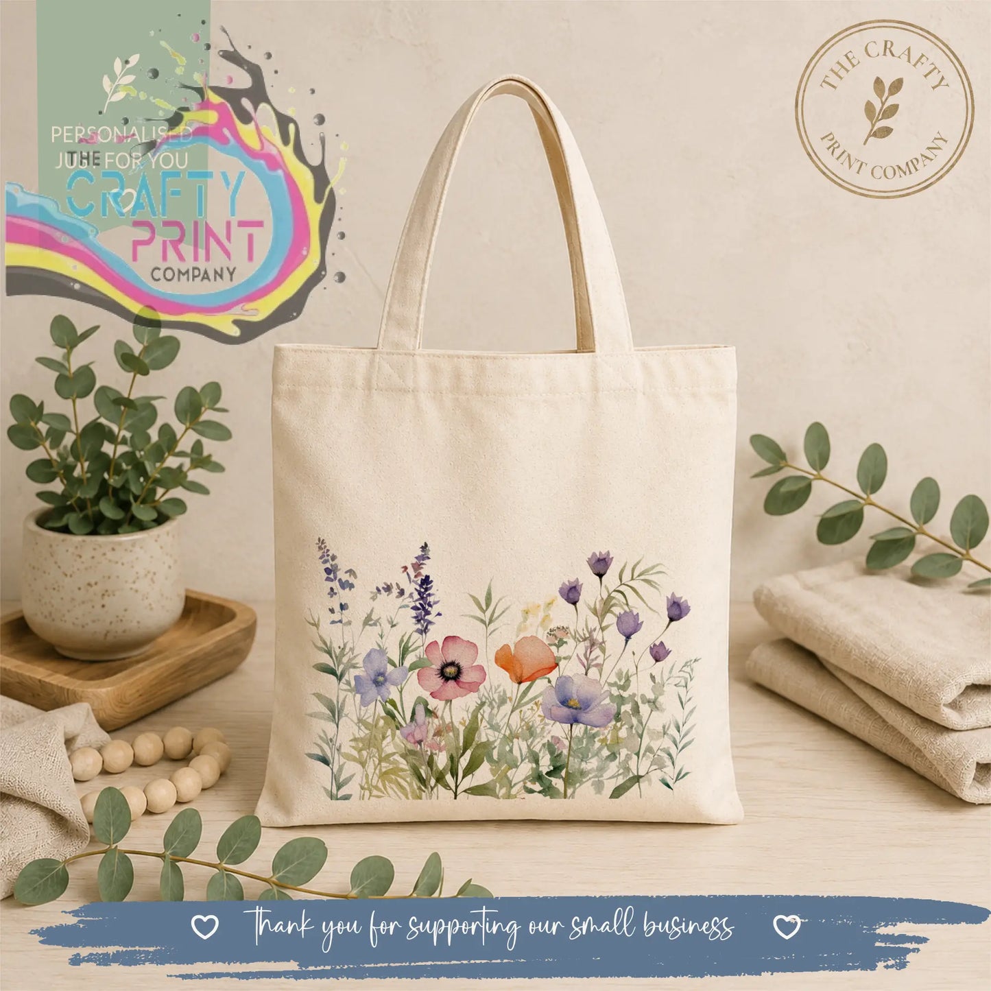 Cream-colored canvas re-usable tote bag with delicate watercolor purple pink and orange floral design wildflower tote bag