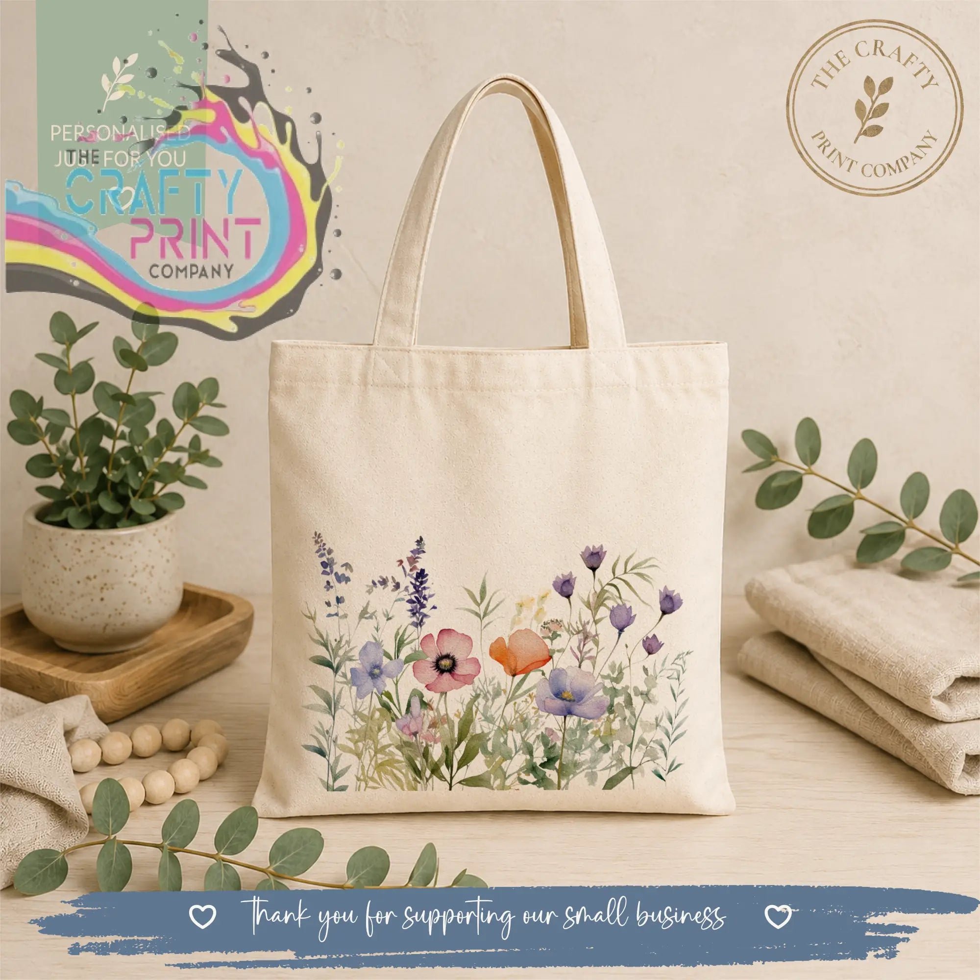Cream-colored canvas re-usable tote bag with delicate watercolor purple pink and orange floral design wildflower tote bag