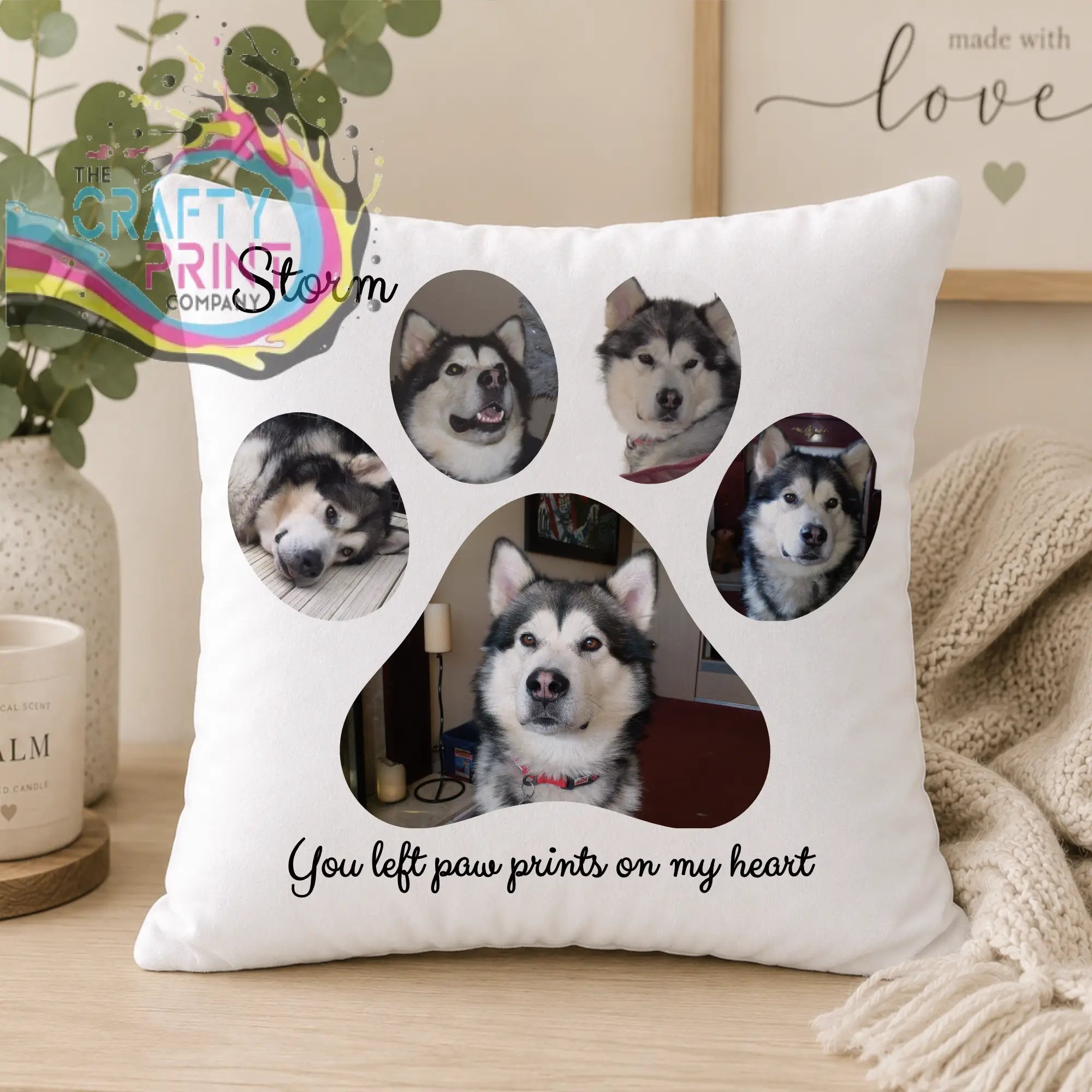 White throw pillow with customizable paw prints design including photos of malamute personalized with storm and left paw prints message